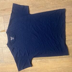 “Plain Navy Blue Gildan T-Shirt on Wooden Floor Background”
